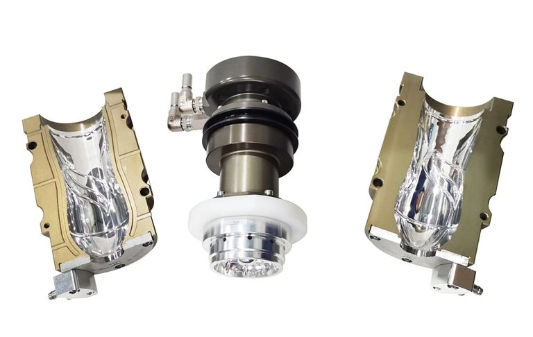 Close-up of a plastic injection mold with three parts