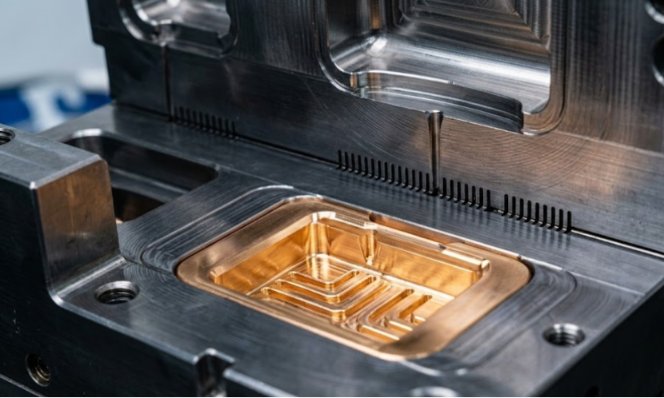 Precision blow mold cavity with copper base insert.