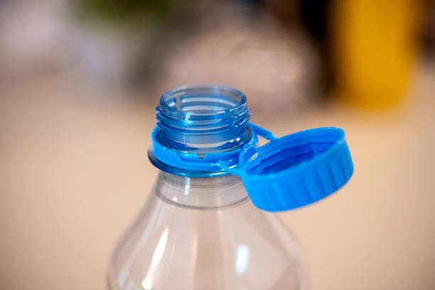 blue tethered cap attached to a water bottle